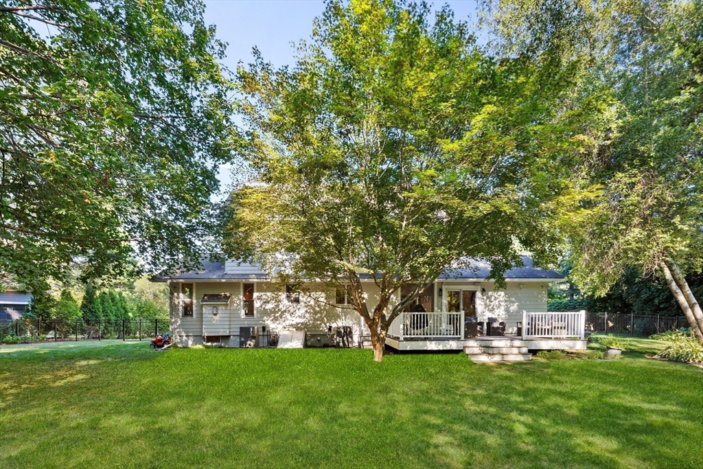 16 Cooke Road Lexington, MA 02420 - Photo 21 of 21 a front view of a house with a garden