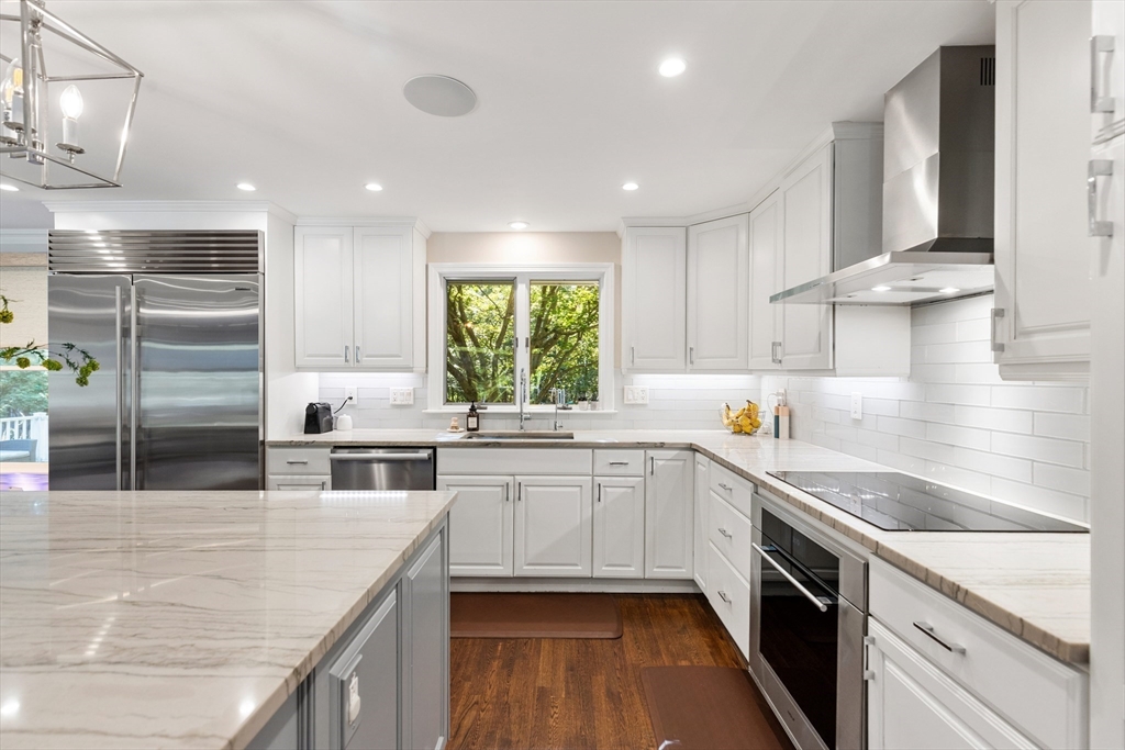 16 Cooke Road Lexington, MA 02420 - Photo 4 of 21 a kitchen with a sink stove and cabinets