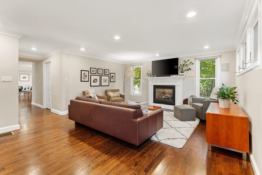 16 Cooke Road Lexington, MA 02420 - Photo 9 of 21 a living room with furniture fireplace and a flat screen tv
