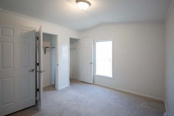 1044 Phillips Road, Unit 12 New Bedford, MA 02745 - Photo 6 of 9 an empty room with windows and closet