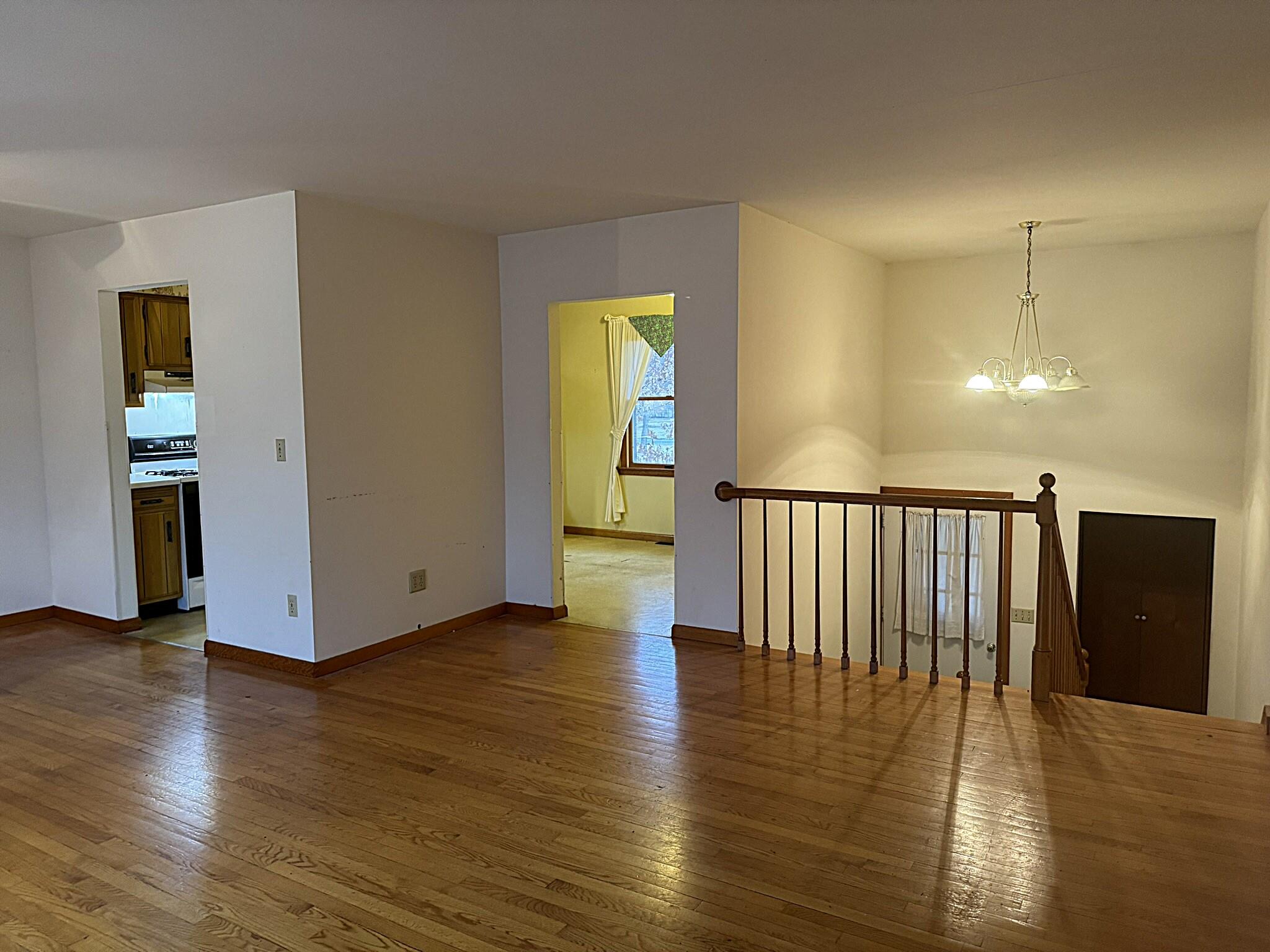 11108 North 550 East Demotte, IN 46310 - Photo 13 of 42 a view of an empty room with wooden floor and a window