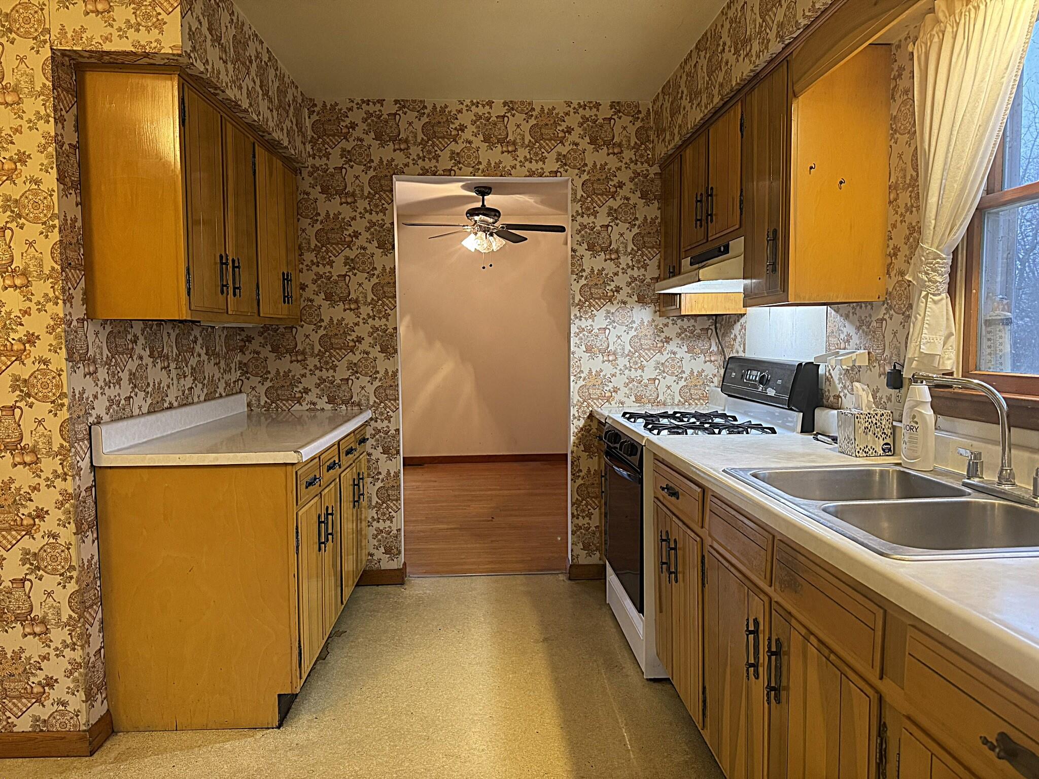 11108 North 550 East Demotte, IN 46310 - Photo 15 of 42 a kitchen with stainless steel appliances granite countertop a sink and a stove