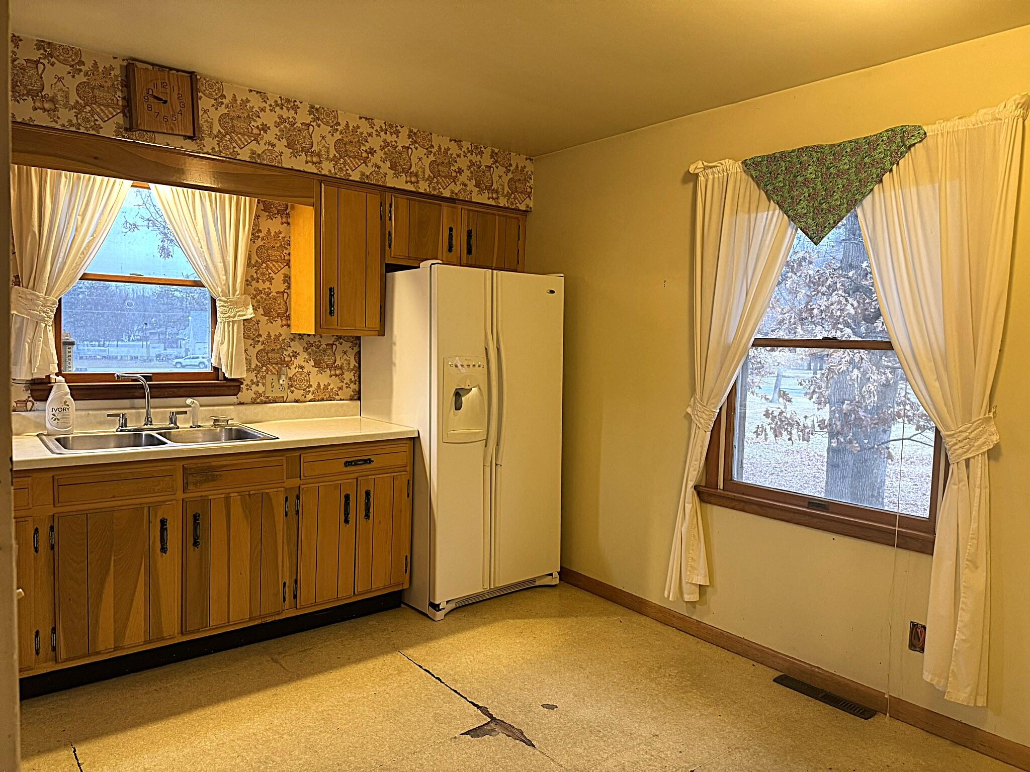 11108 North 550 East Demotte, IN 46310 - Photo 17 of 42 a view of a kitchen with wooden floor and cabinets
