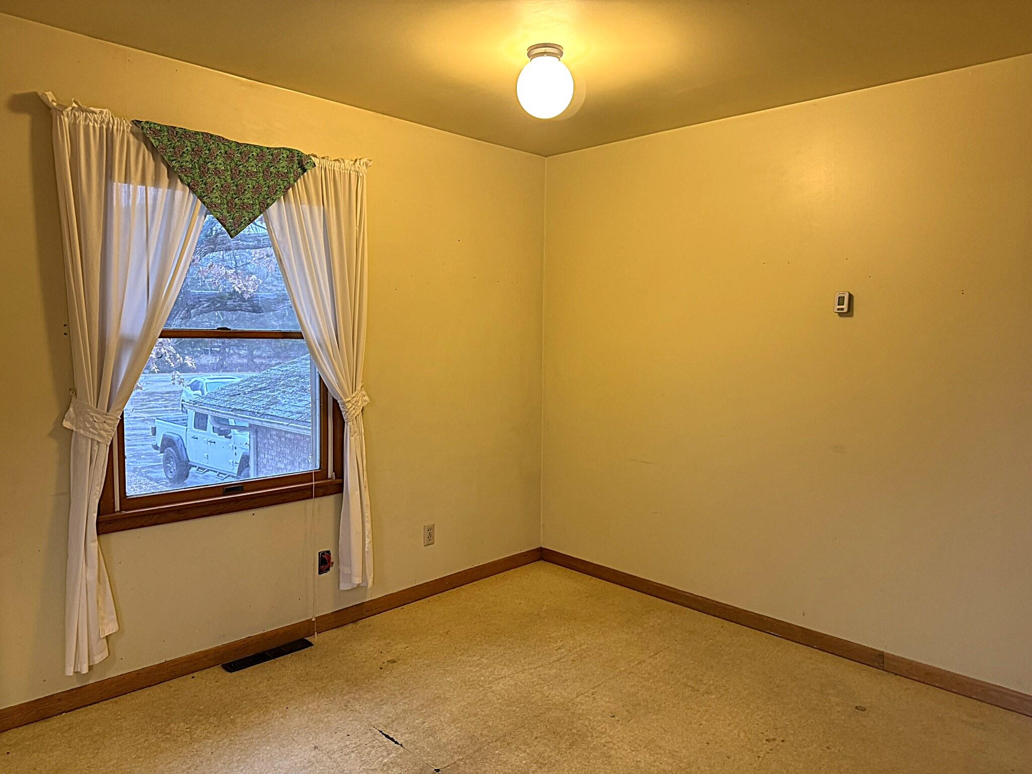 11108 North 550 East Demotte, IN 46310 - Photo 18 of 42 a view of a room with wooden floor and windows