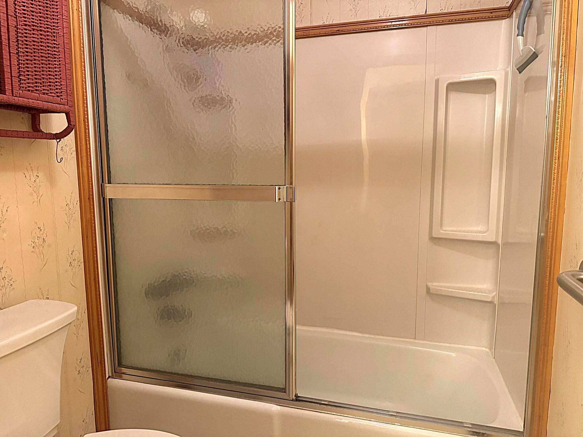 11108 North 550 East Demotte, IN 46310 - Photo 20 of 42 a bathroom with a glass shower door