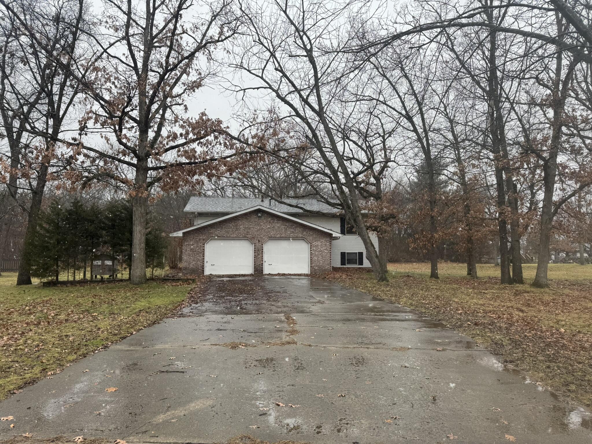 11108 North 550 East Demotte, IN 46310 - Photo 2 of 42 a white house that has a tree in front of it