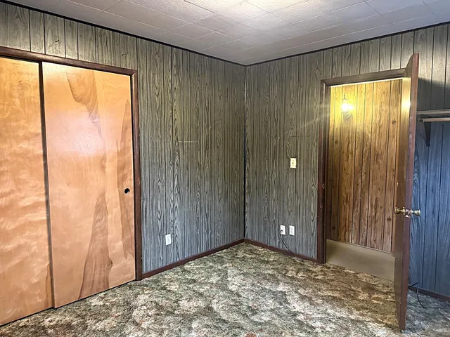 a view of an empty room and a window