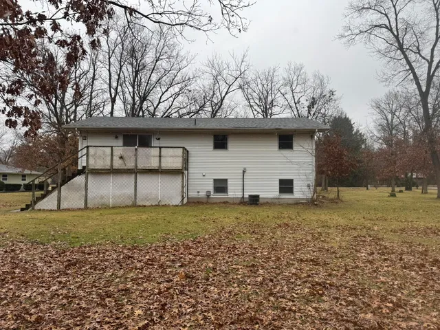 a house with trees in the background