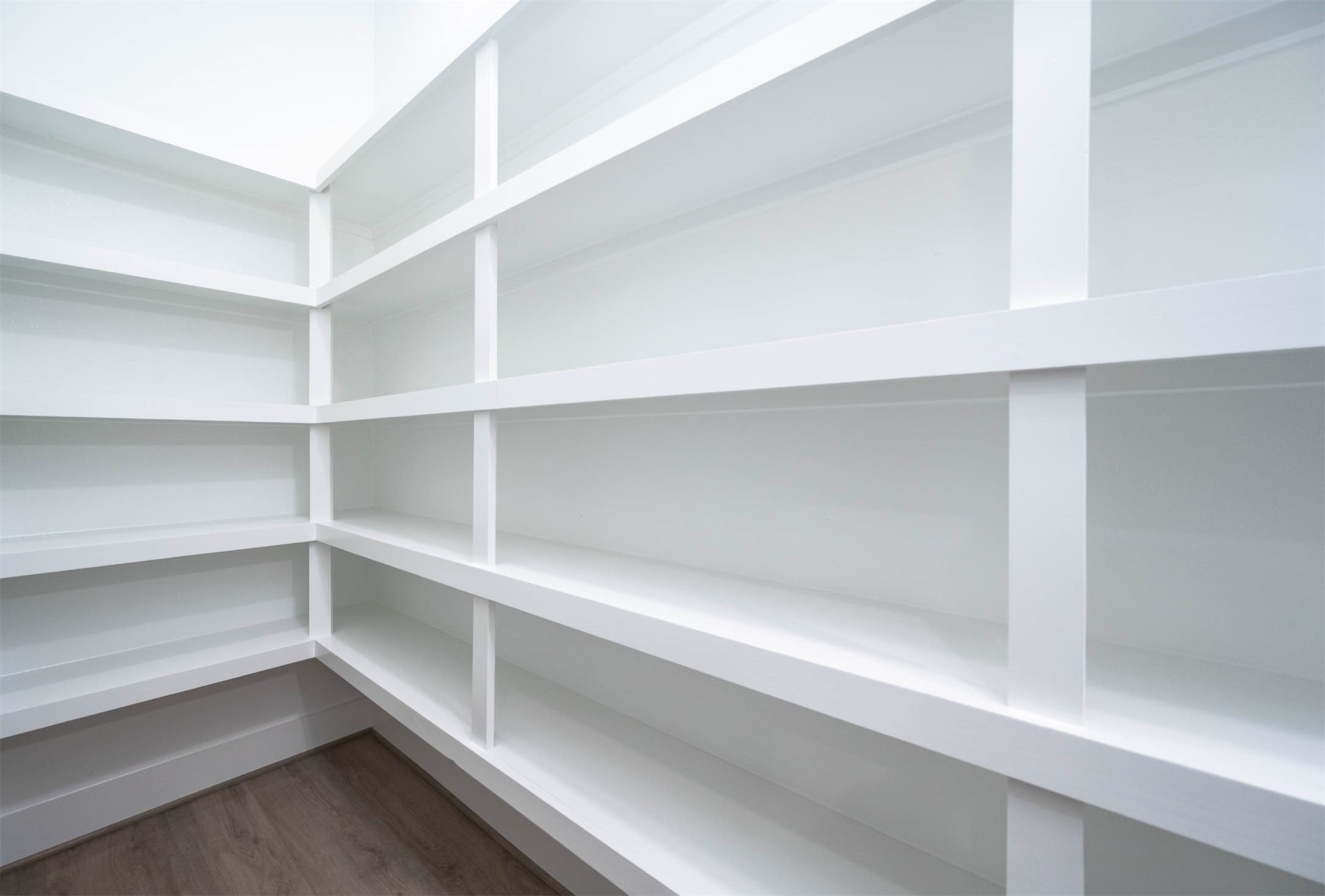 3509 McIlhenny Street Houston, TX 77004 - Photo 11 of 36 a view of walk in closet with empty racks