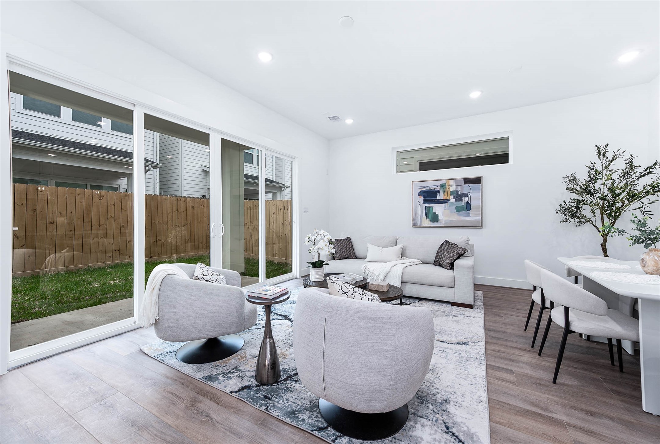 3509 McIlhenny Street Houston, TX 77004 - Photo 17 of 36 a living room with furniture and a floor to ceiling window