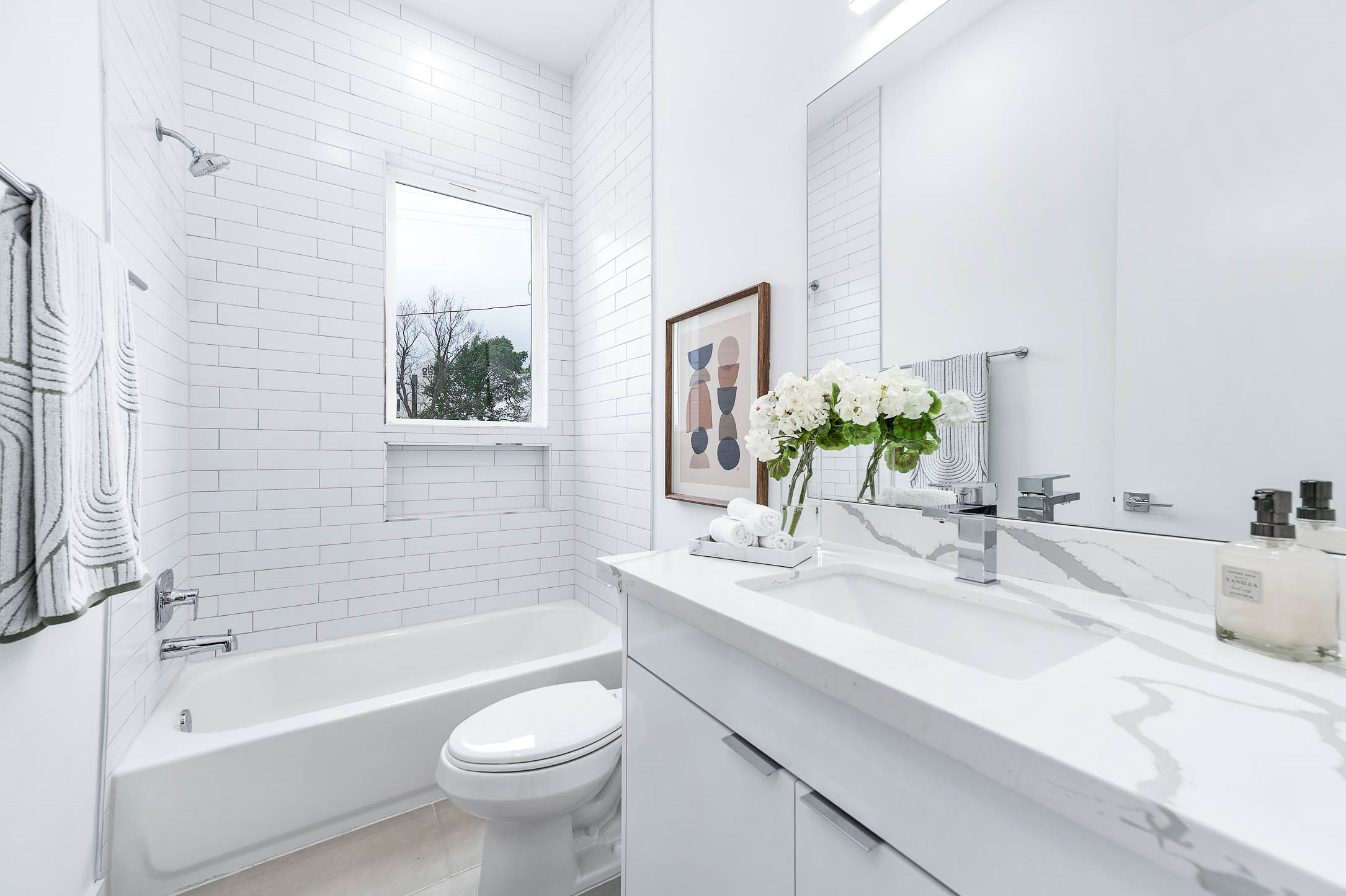 3509 McIlhenny Street Houston, TX 77004 - Photo 31 of 36 a bathroom with a granite countertop sink a toilet a mirror a bathtub and shower