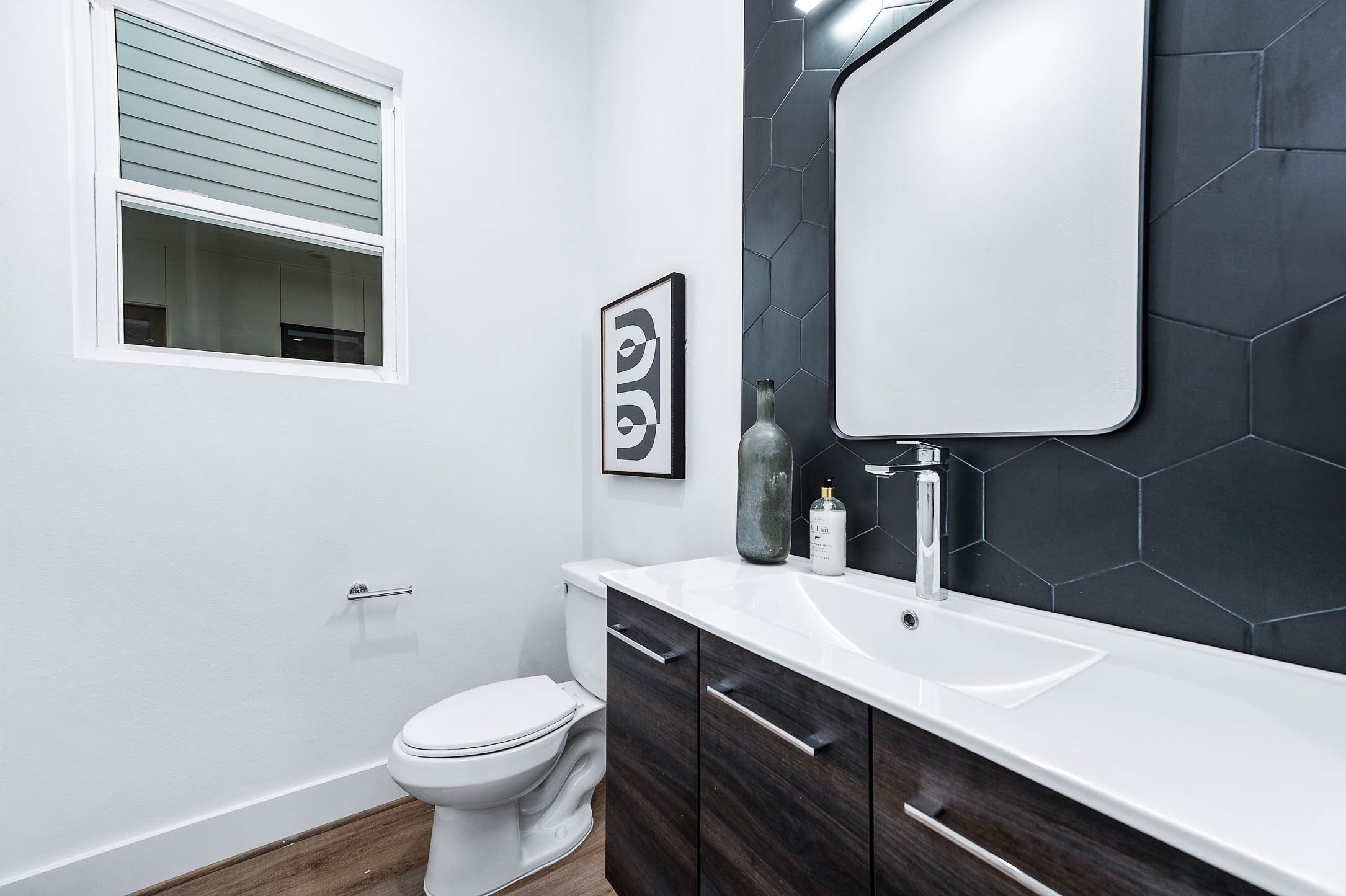 3509 McIlhenny Street Houston, TX 77004 - Photo 8 of 36 a bathroom with a sink toilet and mirror