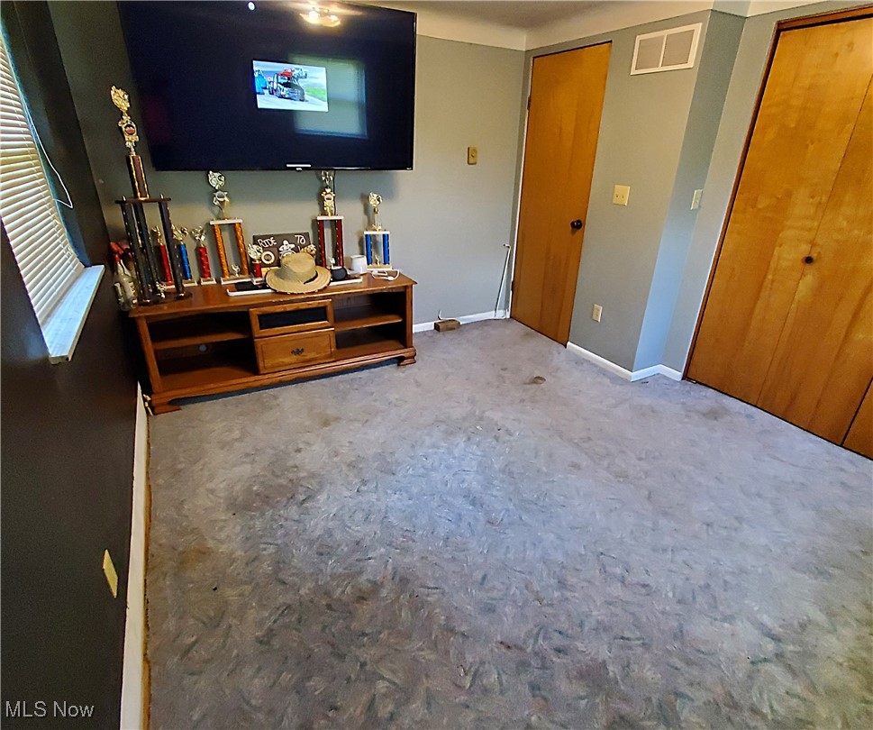13075 Conquer Hill Road Byesville, OH 43723 - Photo 19 of 36 Bedroom featuring carpet flooring and baseboards