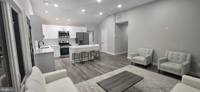 a living room with furniture and a table