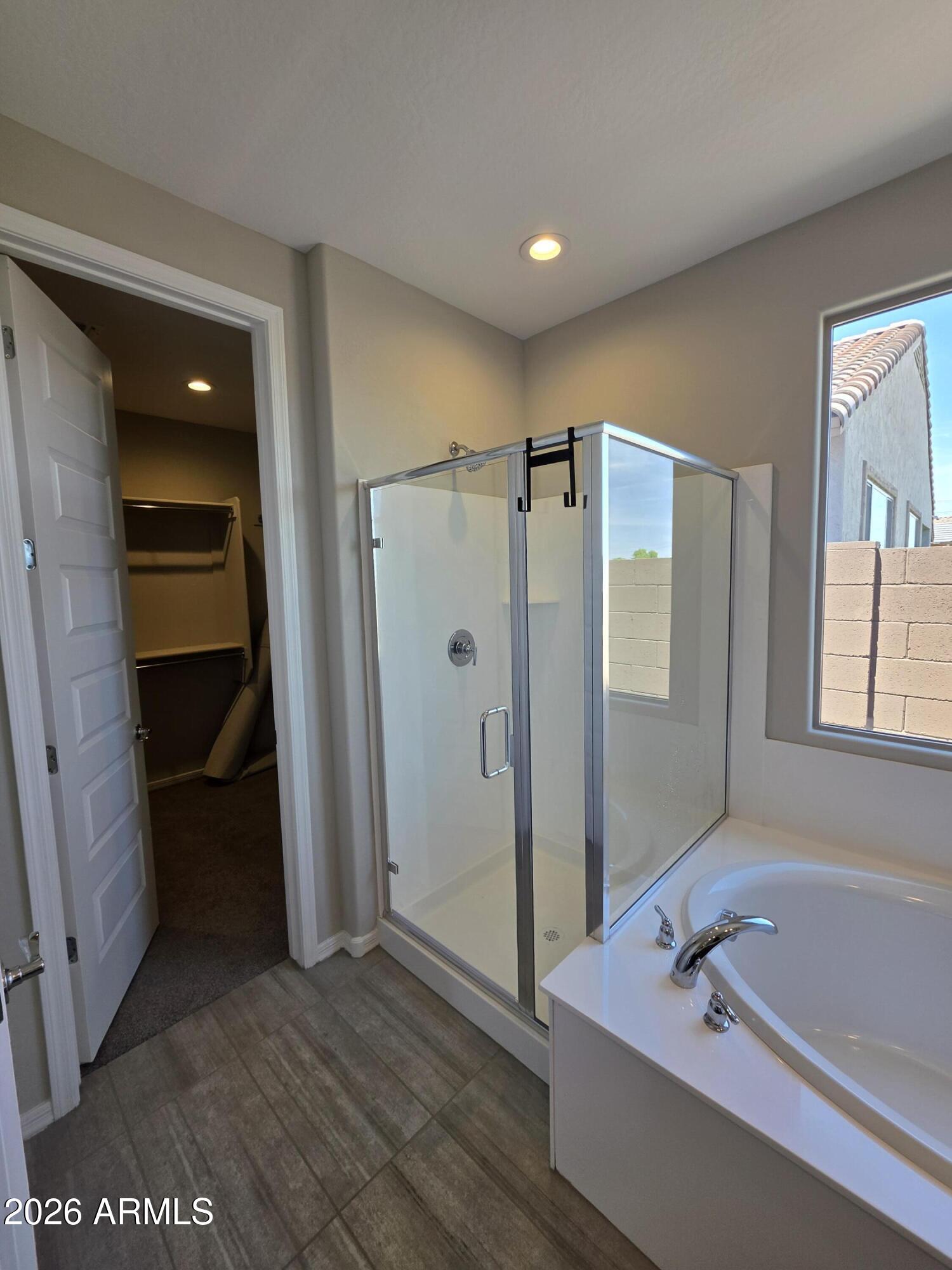 7128 West Coles Road Laveen, AZ 85339 - Photo 16 of 38 a bathroom with a tub shower and a sink