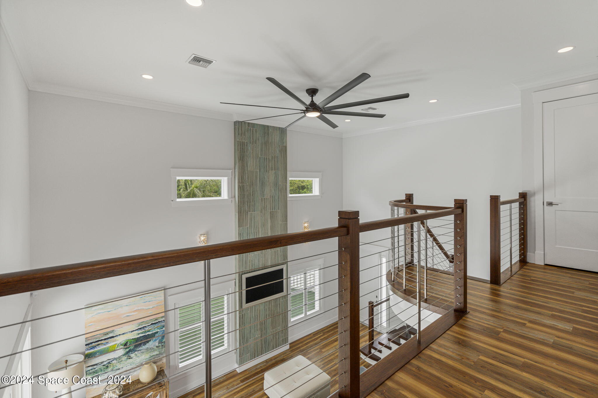 1760 Highway 1 Malabar, FL 32950 - Photo 11 of 40 a view of a livingroom with wooden floor and staircase