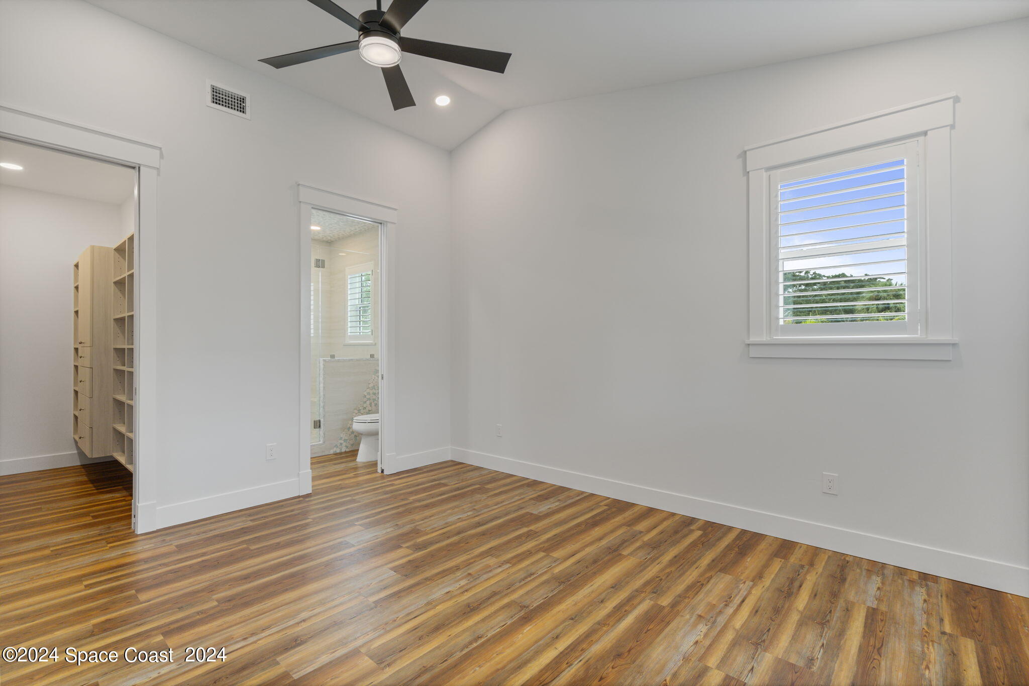 1760 Highway 1 Malabar, FL 32950 - Photo 12 of 40 wooden floor in an empty room with a window