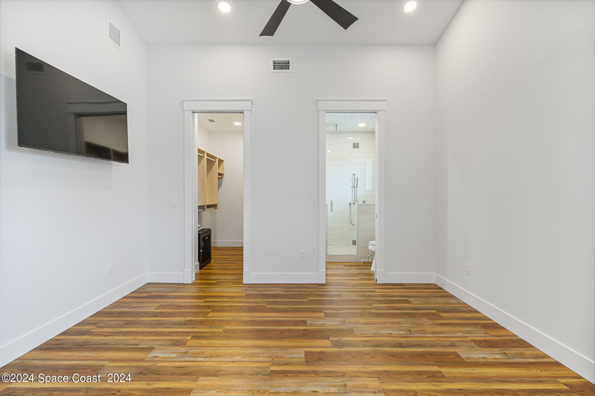 1760 Highway 1 Malabar, FL 32950 - Photo 13 of 40 a view of a livingroom with wooden floor and flat screen tv