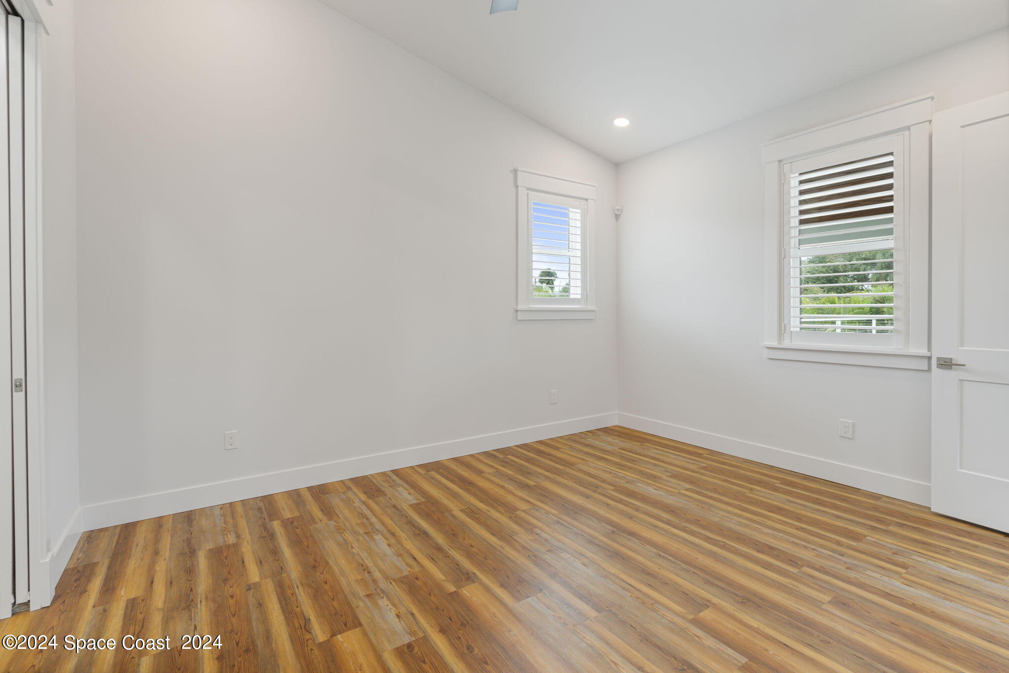 1760 Highway 1 Malabar, FL 32950 - Photo 18 of 40 wooden floor in an empty room with a window