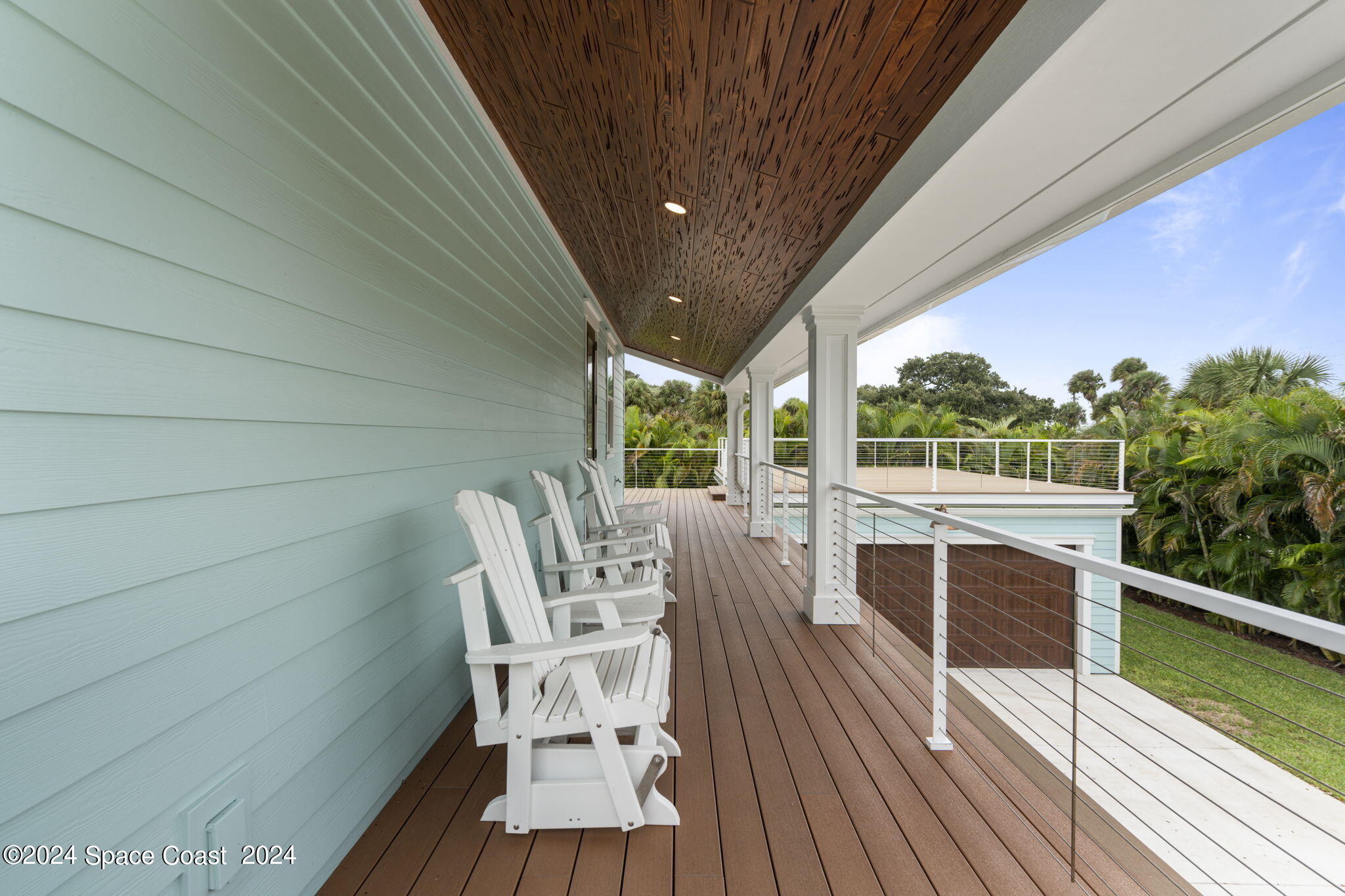 1760 Highway 1 Malabar, FL 32950 - Photo 20 of 40 a view of balcony with wooden floor and outdoor seating