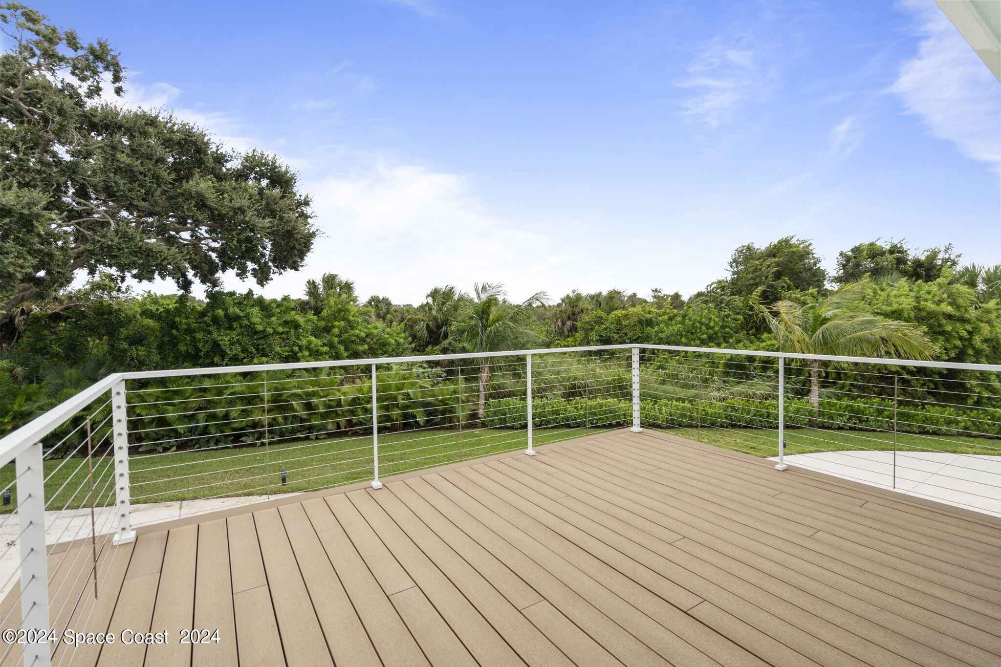 1760 Highway 1 Malabar, FL 32950 - Photo 21 of 40 a view of deck with a flat screen tv and wooden stairs