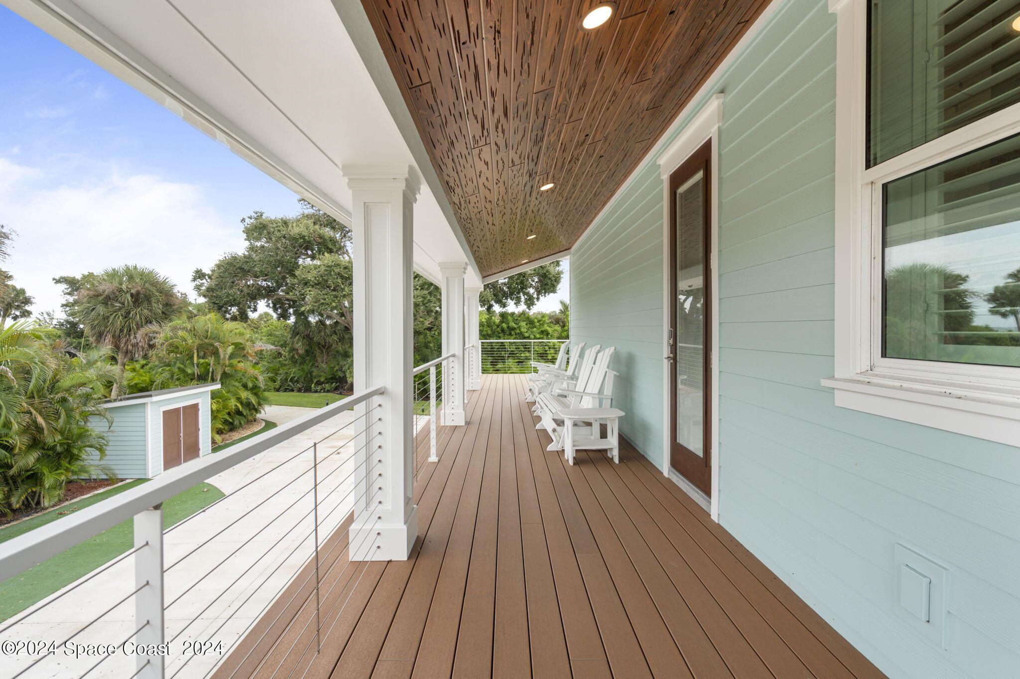 1760 Highway 1 Malabar, FL 32950 - Photo 22 of 40 a view of balcony with wooden floor and iron stairs