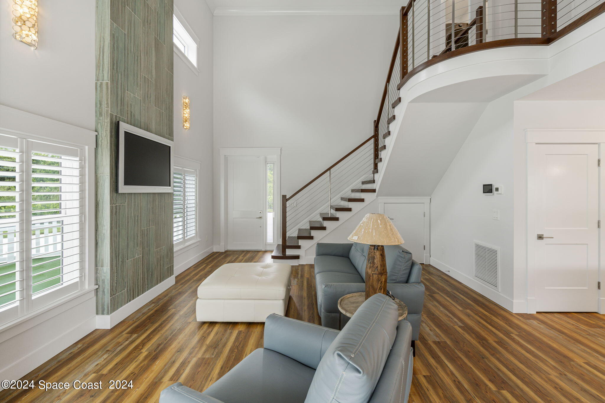 1760 Highway 1 Malabar, FL 32950 - Photo 3 of 40 a living room with furniture and a chandelier