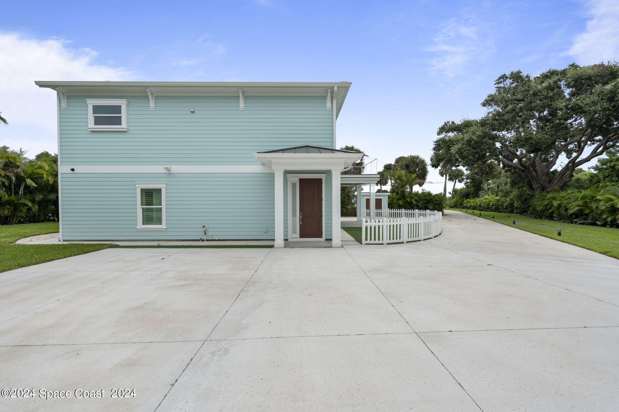 1760 Highway 1 Malabar, FL 32950 - Photo 32 of 40 a view of a house with a yard and garage