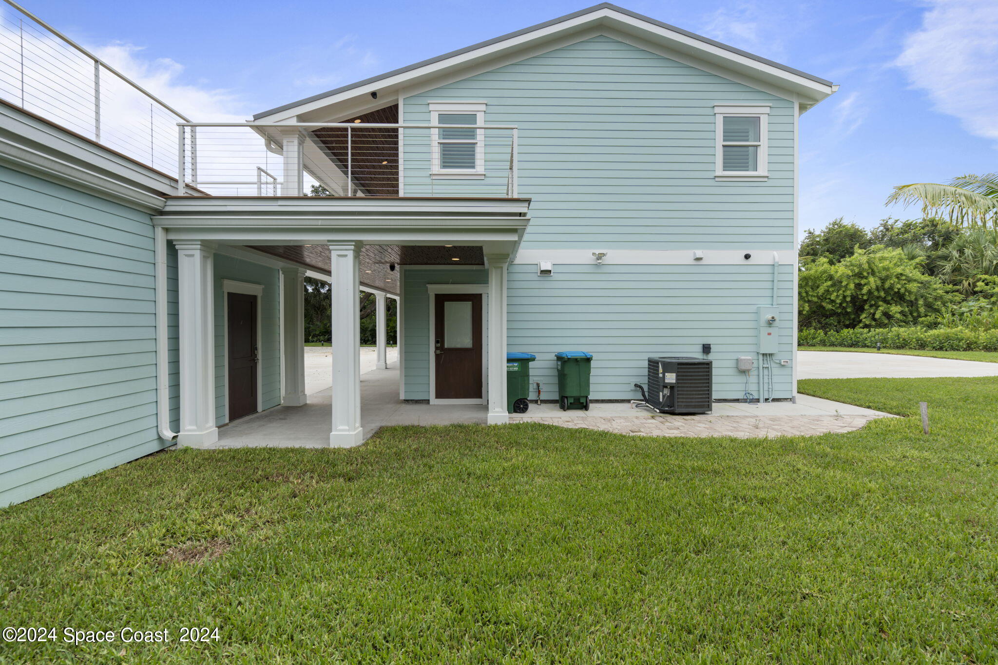 1760 Highway 1 Malabar, FL 32950 - Photo 36 of 40 a front view of a house with a yard and garage