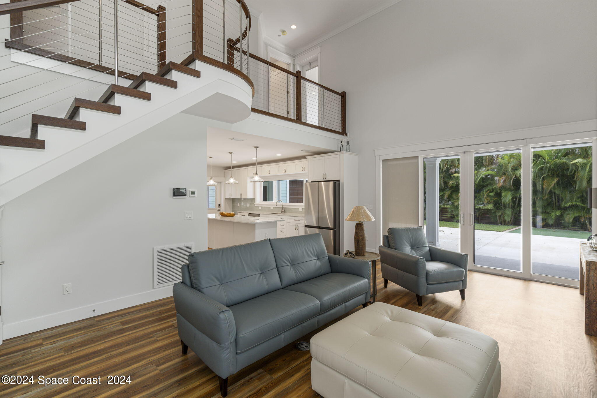 1760 Highway 1 Malabar, FL 32950 - Photo 7 of 40 a living room with furniture and a floor to ceiling window