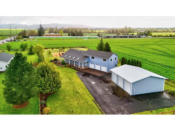 a aerial view of a house with big yard