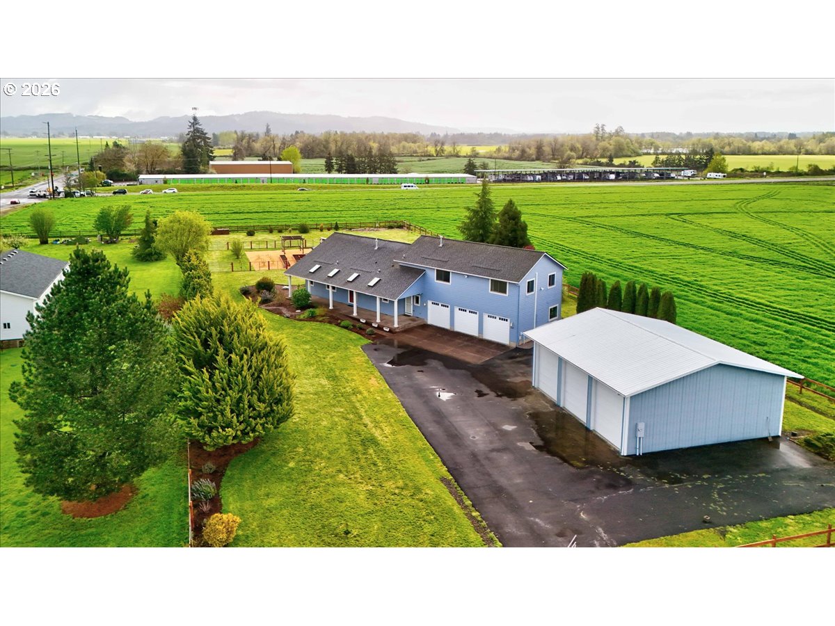 a aerial view of a house with big yard