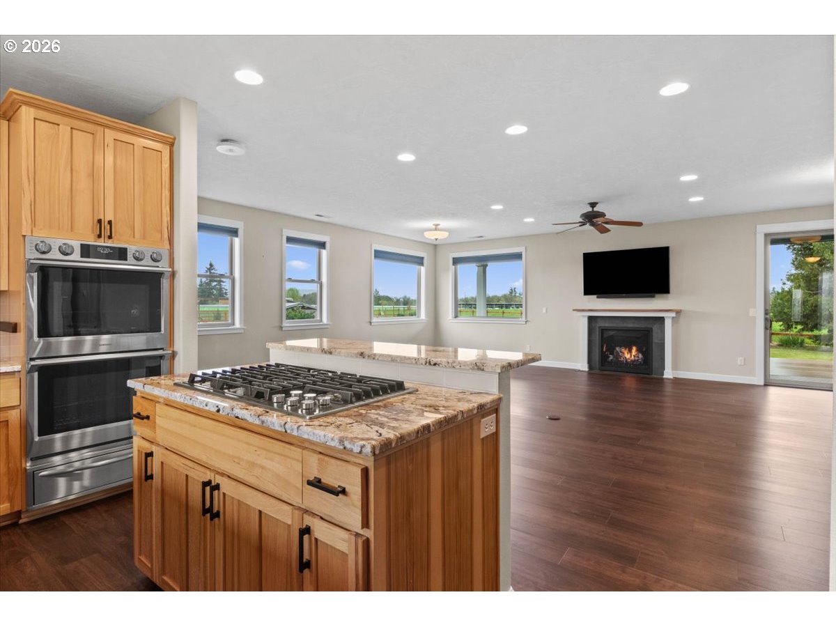 9864 Hoffman Road Monmouth, OR 97361 - Photo 21 of 48 a kitchen with a stove and a wooden floor