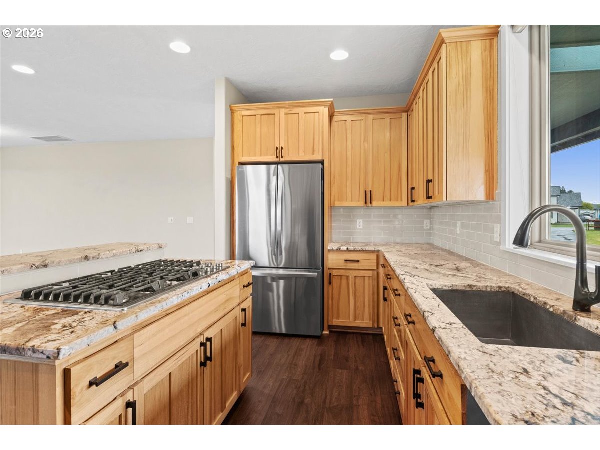 9864 Hoffman Road Monmouth, OR 97361 - Photo 22 of 48 a kitchen with a sink stove and refrigerator
