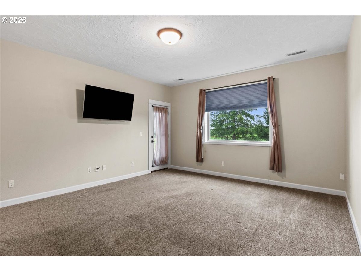 9864 Hoffman Road Monmouth, OR 97361 - Photo 26 of 48 a view of a livingroom with an empty space and a window