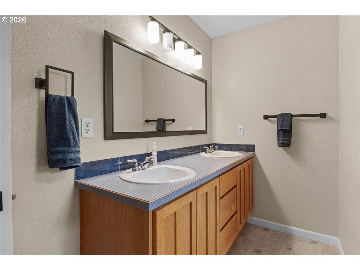 9864 Hoffman Road Monmouth, OR 97361 - Photo 38 of 48 a bathroom with a sink and a mirror