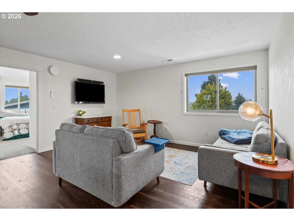 9864 Hoffman Road Monmouth, OR 97361 - Photo 40 of 48 a living room with furniture and a flat screen tv