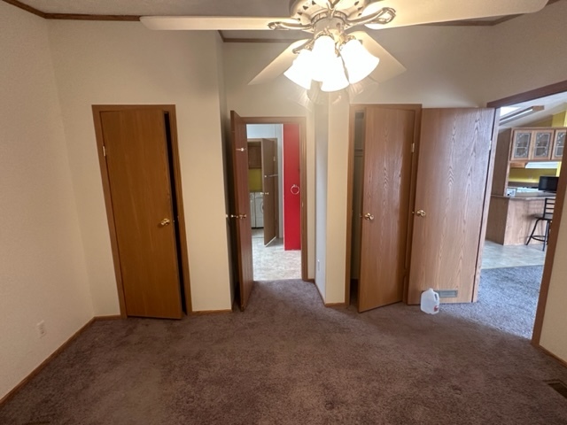 1074 Lakeview Road Elgin, IL 60123 - Photo 11 of 32 an empty room with closet and a chandelier fan