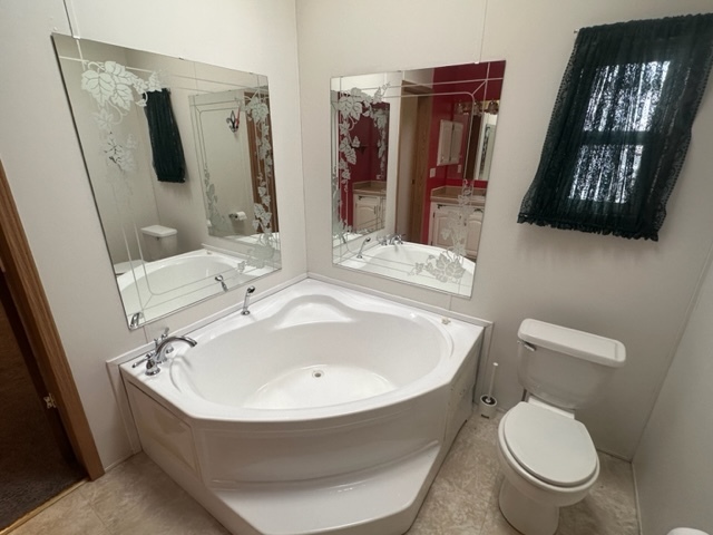 1074 Lakeview Road Elgin, IL 60123 - Photo 13 of 32 a bathroom with a toilet sink and mirror