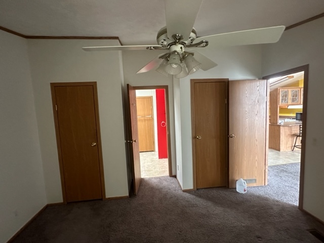 1074 Lakeview Road Elgin, IL 60123 - Photo 16 of 32 a view of a livingroom with a ceiling fan and window