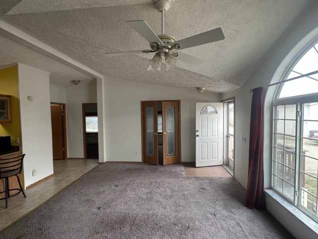 1074 Lakeview Road Elgin, IL 60123 - Photo 5 of 32 a view of a big room with windows and chandelier fan