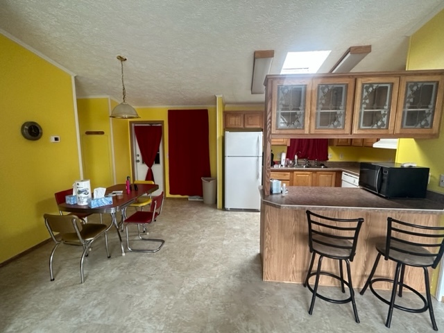 1074 Lakeview Road Elgin, IL 60123 - Photo 6 of 32 a living room with furniture a dining table and chairs