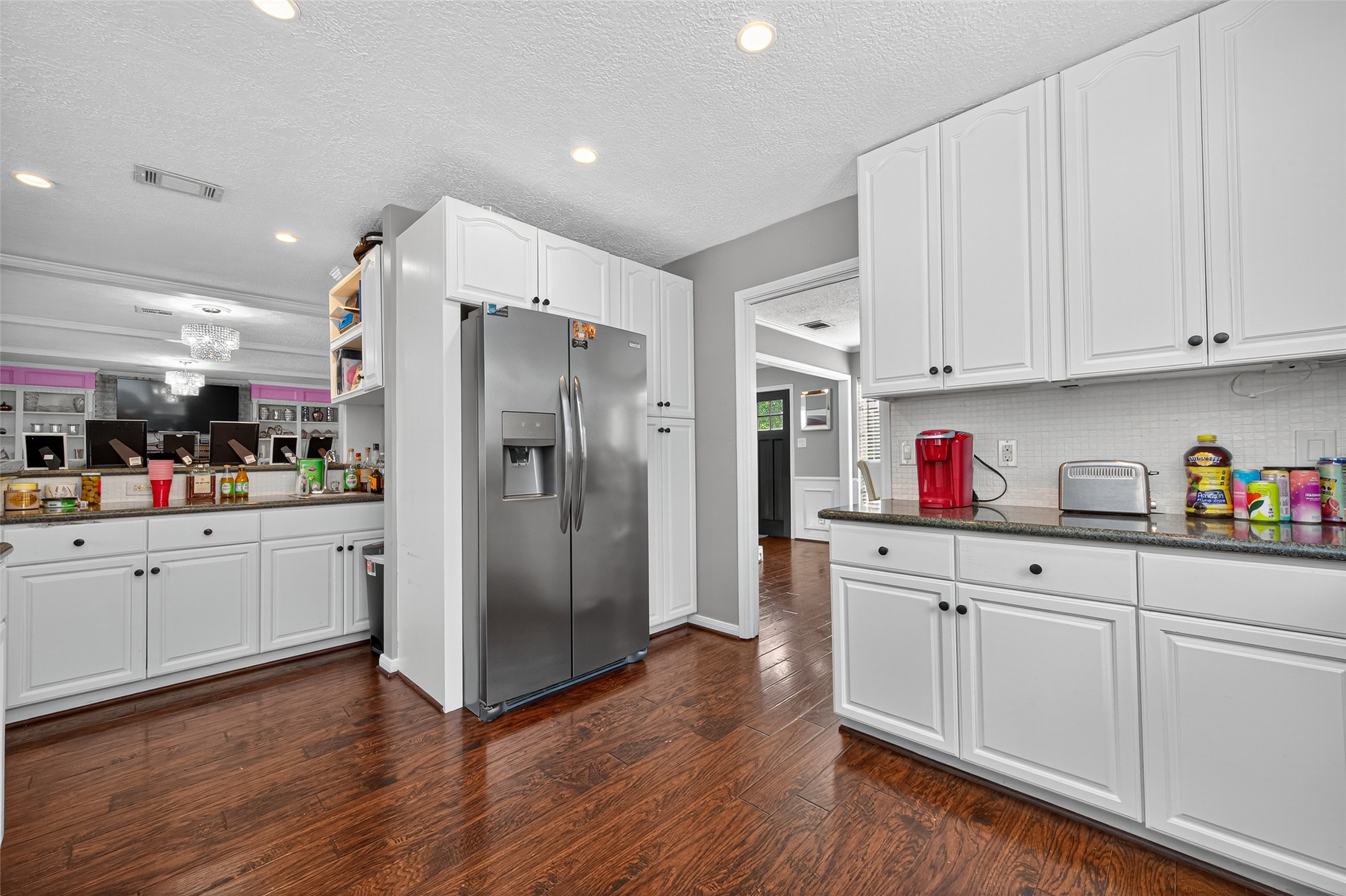 3602 Blue Cypress Drive Spring, TX 77388 - Photo 15 of 44 a kitchen with white cabinets and stainless steel appliances