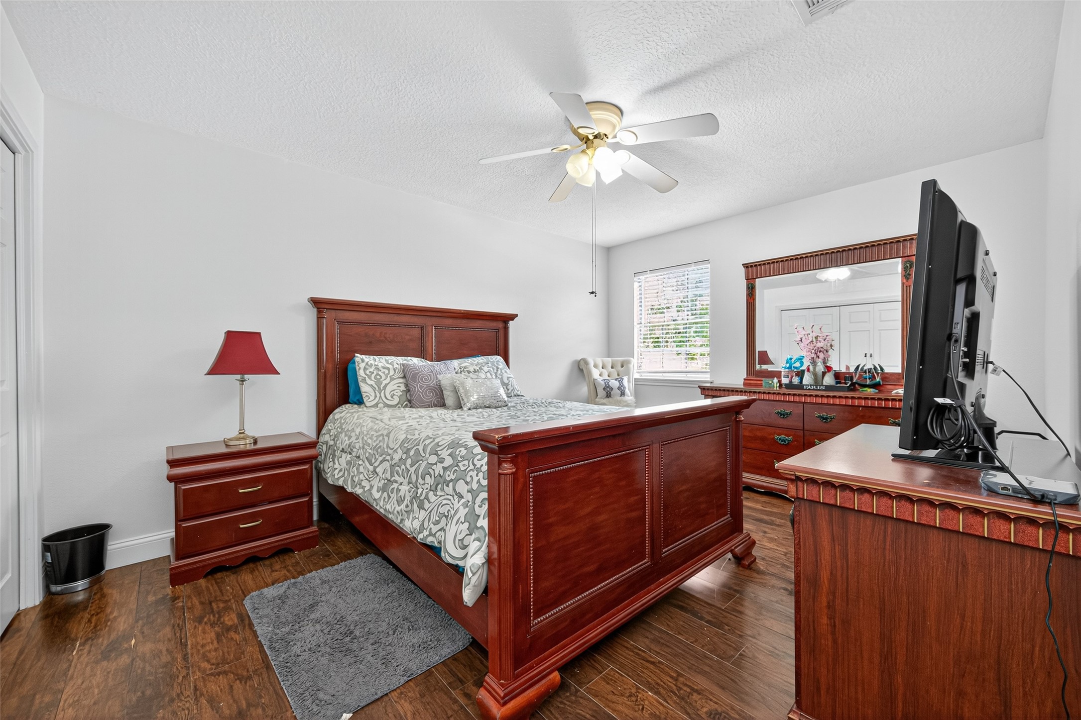 3602 Blue Cypress Drive Spring, TX 77388 - Photo 33 of 44 a large bedroom with a bed and wooden floor