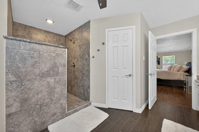 a view of a bathroom with a shower and a bathroom