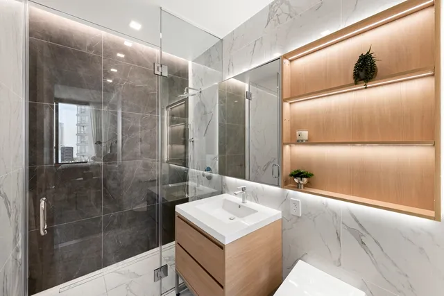 a kitchen with a sink cabinets and a window