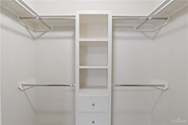 a view of an empty walk in closet