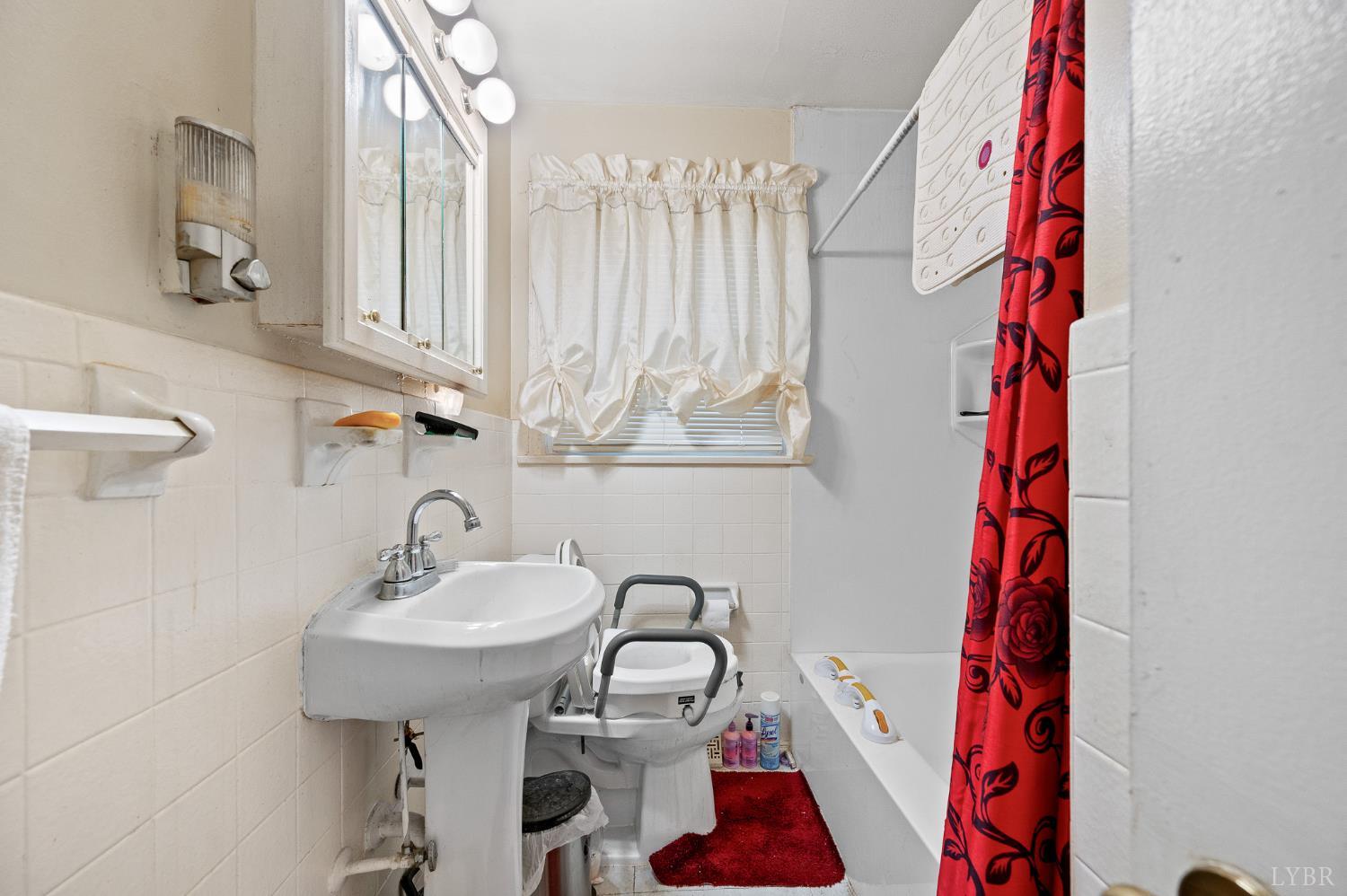 129 Greendale Drive Rustburg, VA 24588 - Photo 15 of 35 a bathroom with a sink and a mirror