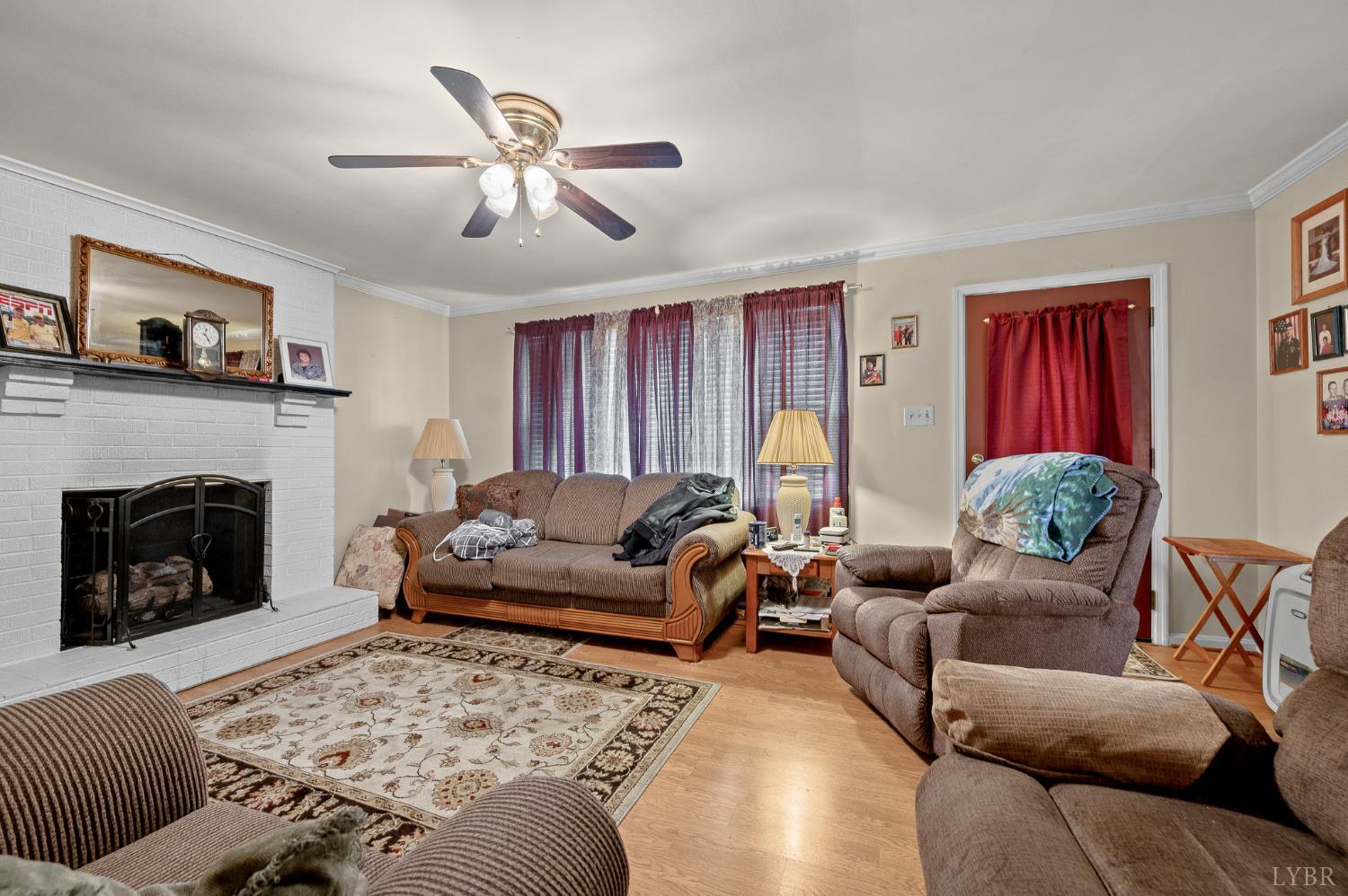 129 Greendale Drive Rustburg, VA 24588 - Photo 6 of 35 a living room with furniture and a fireplace