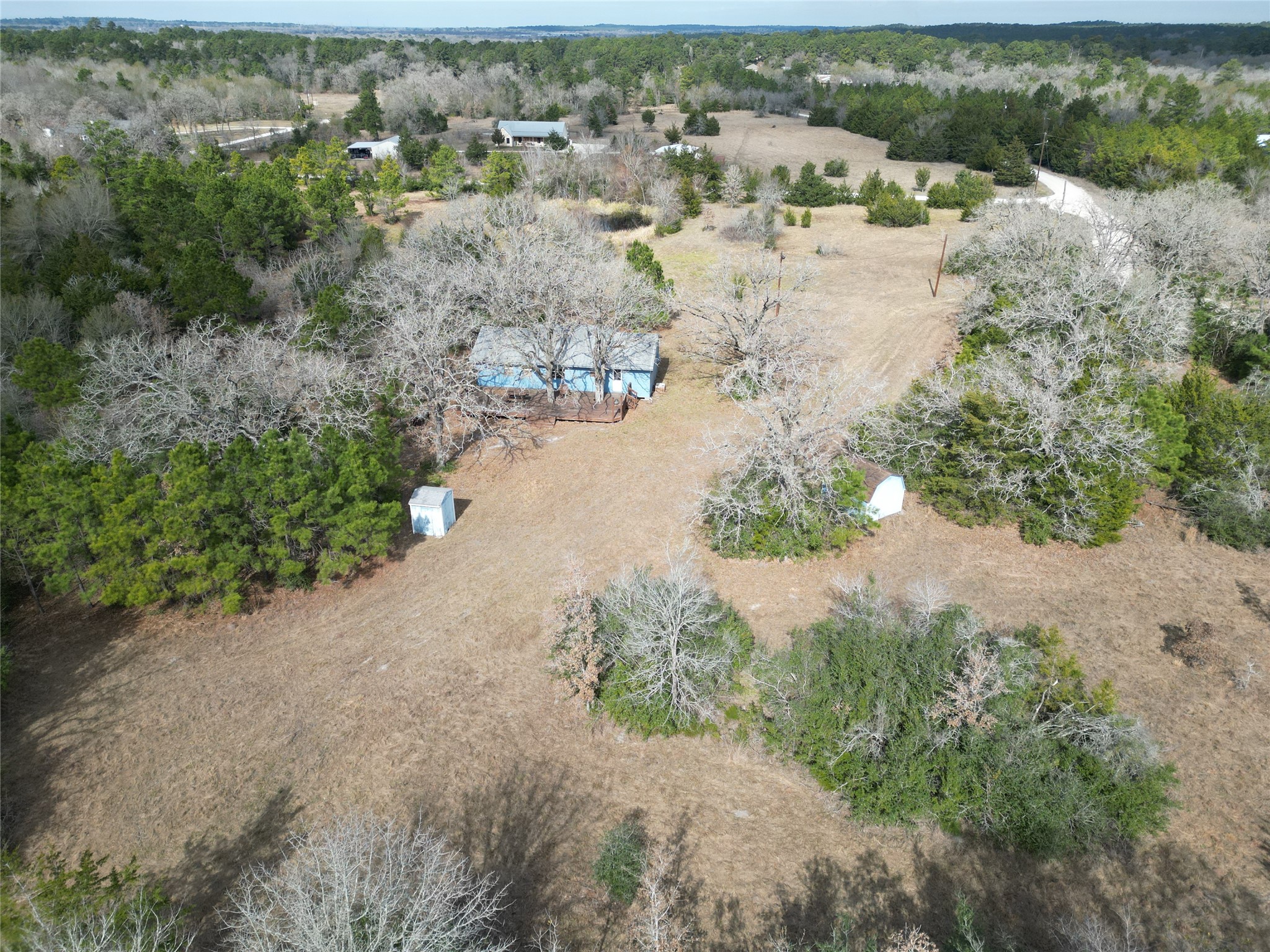10173 Deer Ridge Road Bedias, TX 77831 - Photo 3 of 46 an aerial view of ocean with residential houses with outdoor space